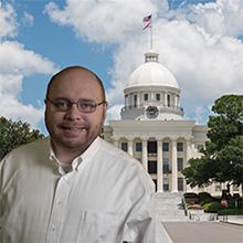 Photo of Caleb Bagwell with Alabama state capitol in background