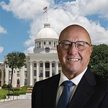 Photo of David Ivey with Alabama state capitol in background