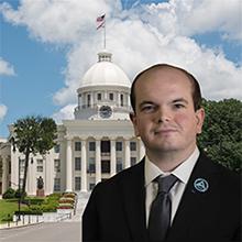 Photo of Jacob Ennis with Alabama state capitol in background