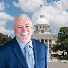 Photo of Michael Frazier with Alabama state capitol in background